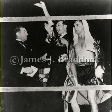 Jim with manager Joe Gould, wins decision over Tommy Farr. Madison Square Garden, 1938.