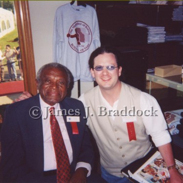 Grandson Braddock with the great late trainer Eddie Futch at the International Boxing Hall of Fame. Mr. Futch trained Joe Frazier and Ken Norton who both beat Muhammad Ali. 2001.