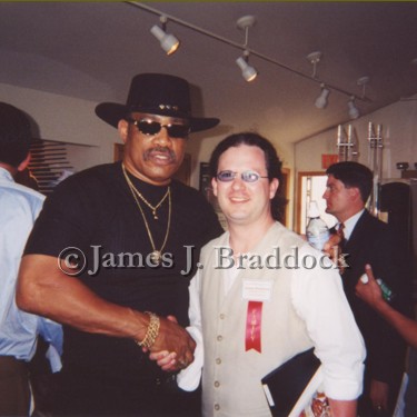 Grandson Braddock with the Champ, Ken Norton. Mr. Norton broke Muhammad Ali's jaw with that right hand. 2001.