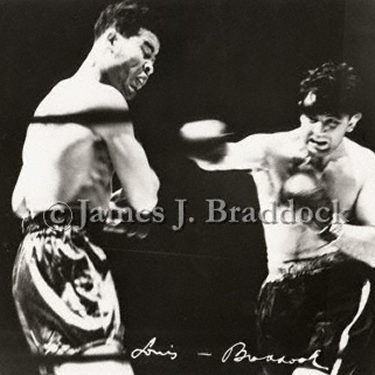Joe Louis receives a solid right hand from Braddock