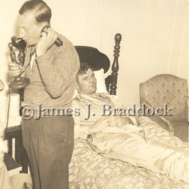 Manager Joe Gould answers phones while Braddock rests after a fight