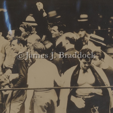 James J. Braddock celebrates winning the Heavyweight Championship of the World as Max Baer hangs his head in defeat. June 13, 1935 Long Island City.