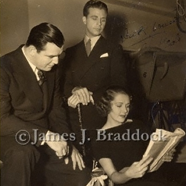 Jim looks over movie scripts with Dick Powell and Ruby Keeler