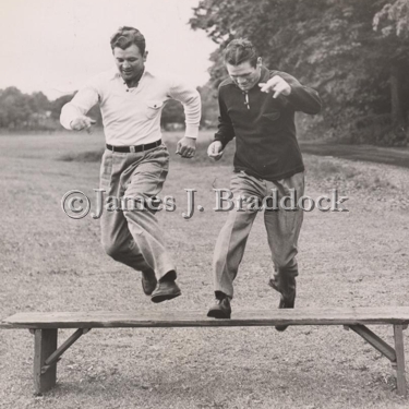 Jim Braddock, and his sparring mate Jack McCarthy, lift them up and put them down while training for the nearing Joe Louis fight. 6/18/1937