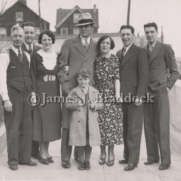 Left to right: Father Peter Fox, son Peter, Daughter Mae(the champs wife), James J. Braddock, child Raymond Beck, Mother Mary Fox, and sons Harry and Raymond Fox.